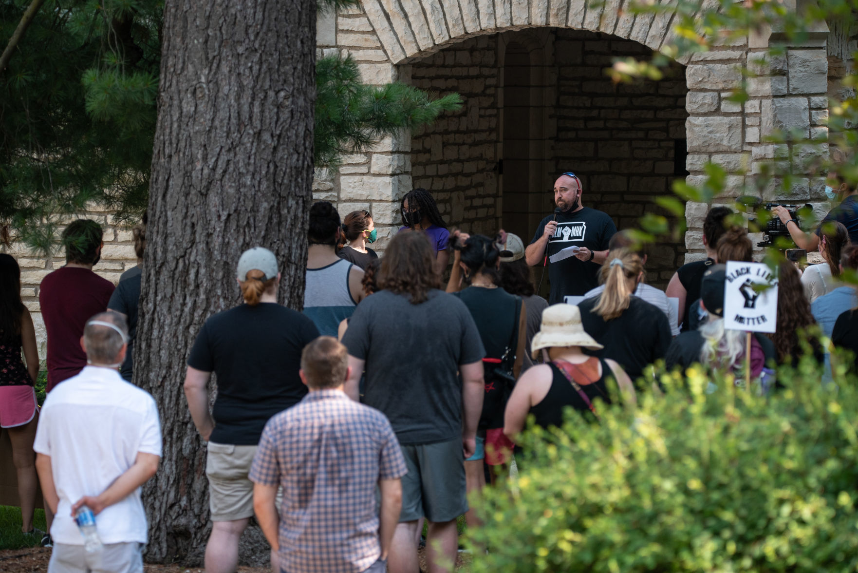 Dustin Delehanty, a retired school teacher, speaks from the entrance of the PresidentÕs Residence to peaceful protestors on Saturday.